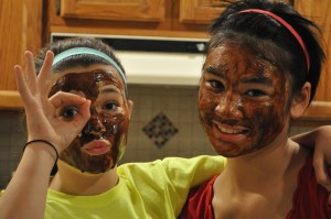 Emily and Kelly trying out a homemade face mask they made. 