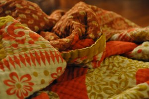 Isn't it beautiful! It was a complete surprise on Christmas morning to get this. This is a kantha blanket, made from used saris by women at risk in Bangladesh. The company that sells these blankets is Hand and Cloth (handandcloth.org). Through making blankets for Hand and Cloth, these women can support themselves and their families with dignified work and they also hear the Word of God that tells them they have value simply because they are creations of God. 