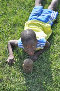 And here's one of my crazy boy with a dirt clod he found at a soccer game last week.