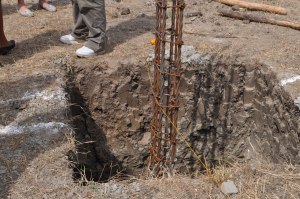 Holes for the concrete foundation for Springs of Hope's permanent home. These were dug by hand!