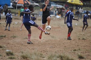 We had a few scraped knees and elbows, but amazingly no big injuries (either team) playing on KIbera's slanted dirt-and-rocks field. 