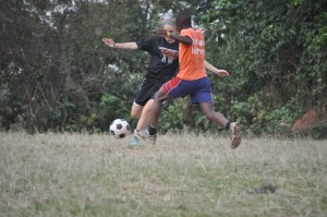 Playing with the boys. This is Sez (Anna S) squaring off with Isaac, one of the older boys helps a lot at both Mercy and at Wilfred and Vena's house.