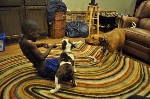 PJ, Nora, and Chai playing tug of war