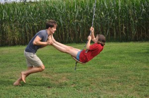 Cousin Seth giving Maddie a ride on their tree swing--always a huge hit!
